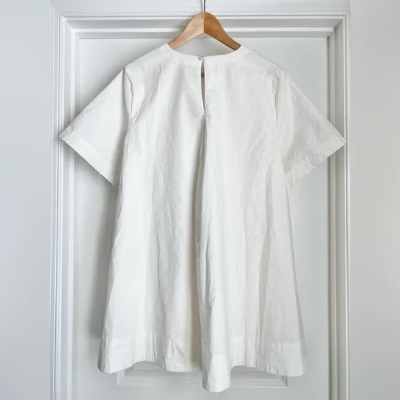 mini white cotton dress Donna Cotton Embellished Mini Dress in ivory
